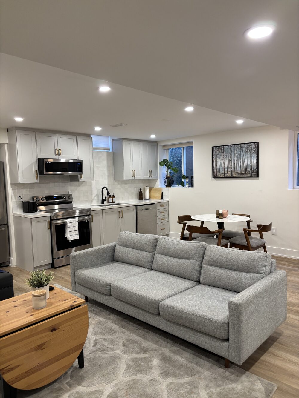 Open-concept living room and kitchen of Kazim's own Milton listing
